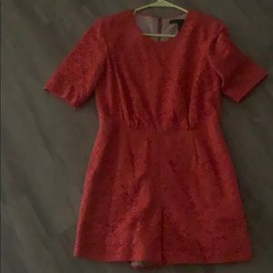 Orange one piece romper. Shorts zipper in the back